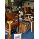 A metal coat stand, table top easel, two pictures and a wooden door knob.