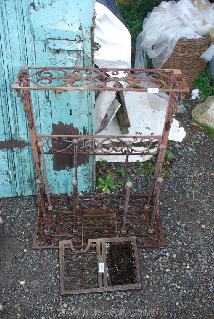 A cast iron Boot stand and boot scraper, 25'' wide x 30'' high.