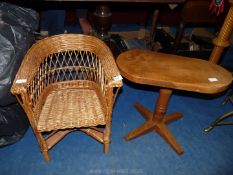 A child's wicker chair and rustic occasional table.