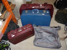 Three suitcases and a Carlton travel suit bag.