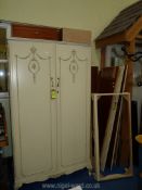 A pair of cream painted wardrobes, one dismantled, 76" high x 42 1/2" wide x 22" deep.