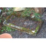 A shallow Stone trough, 37'' x 16 1/2''.