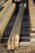 Eleven lengths of softwood 2" x 2" x 102 1/2" long.