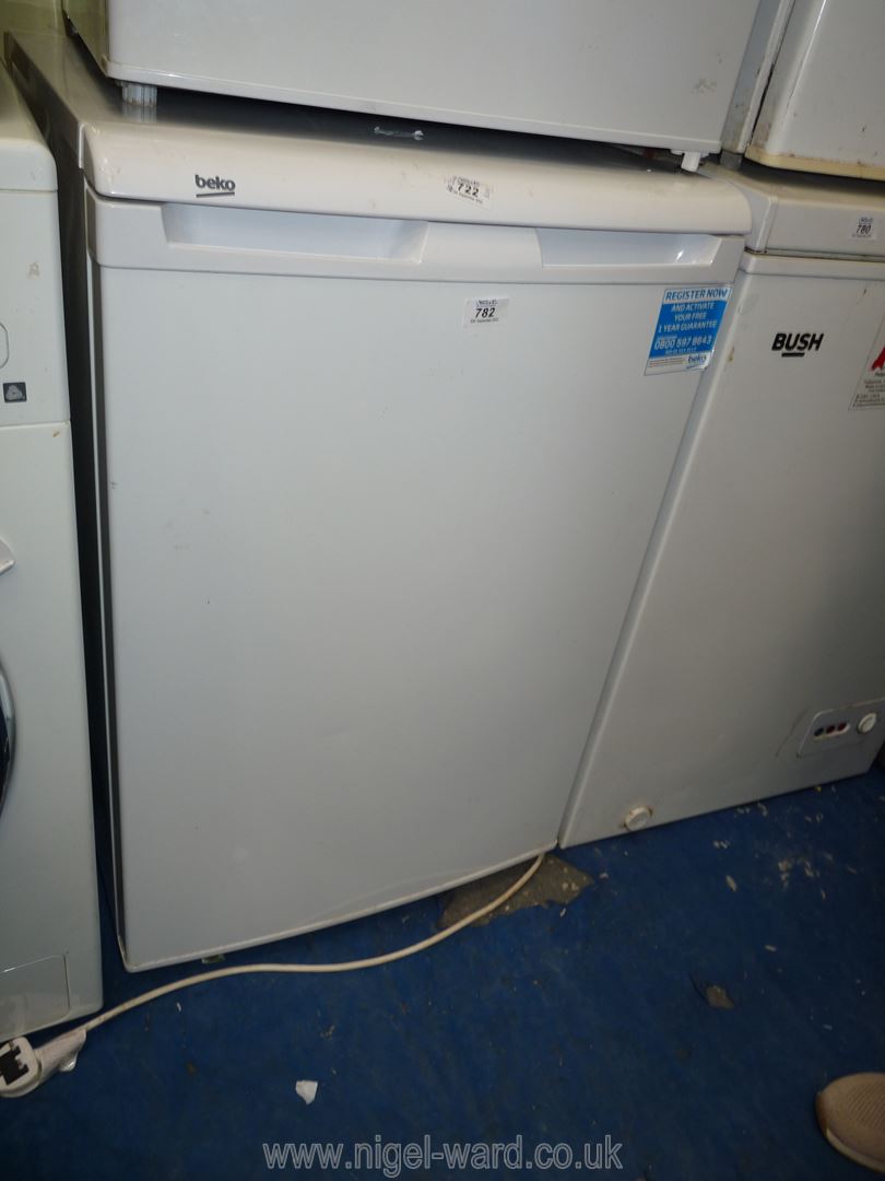 A Beko under counter fridge, 33'' high x 21 1/4'' wide x 22'' deep.