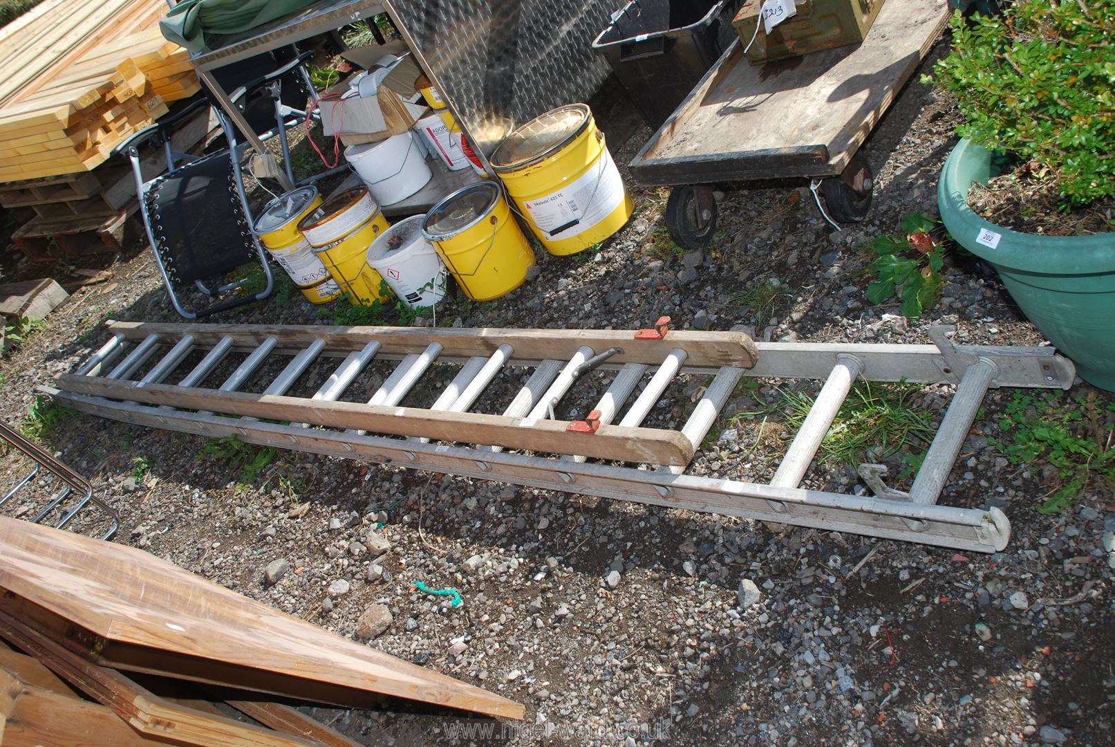 A 13 rung aluminium ladder and 11 rung aluminium/wooden ladder.