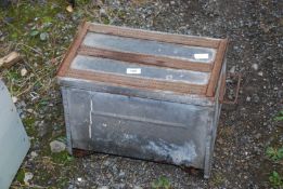 A metal tool-box/slipper box.