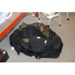 Camouflage clothing in a large holdall, etc.