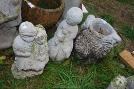 Two garden ornaments and lion head plant pot.