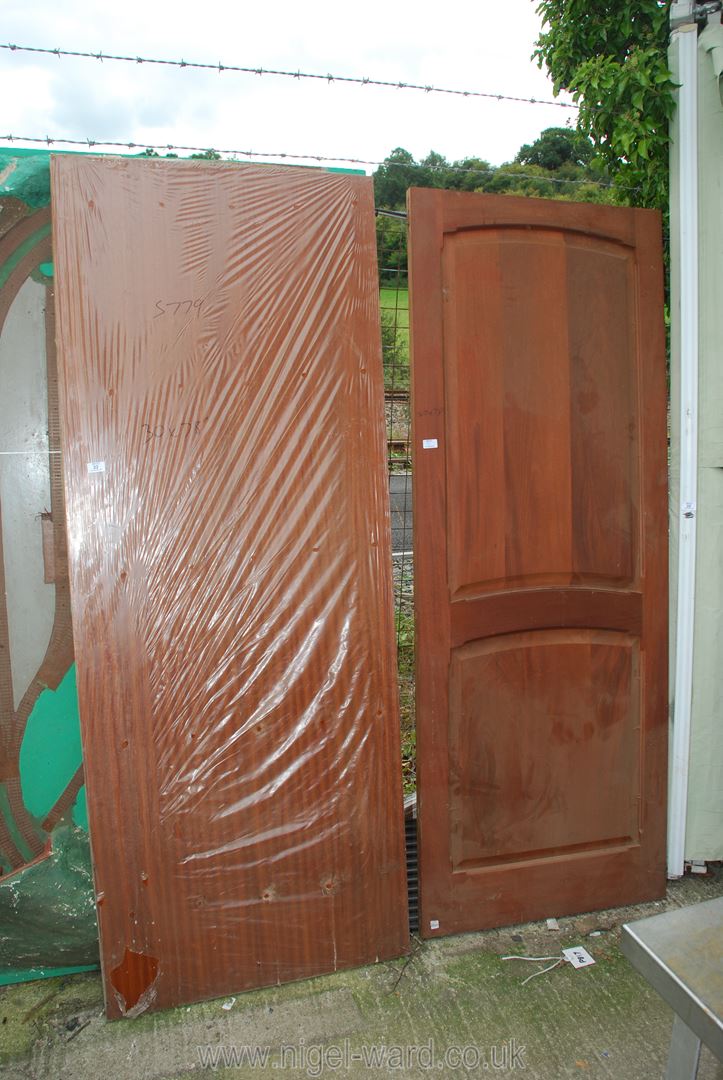 Two doors, one hardwood 30'' x 78'', the other wood-grain finished 29'' wide x 78'' high.