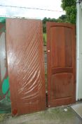 Two hardwood doors, one 29'' x 78'', the other 30'' wide x 78'' high.