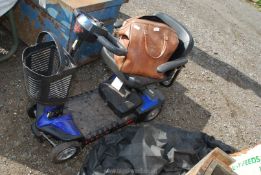 A "Style plus" mobility scooter (no lead or key), plus a bag and contents.