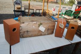 A wooden storage box and 3 wooden bird boxes.