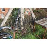 A pair of metal garden gates with posts 40" wide x 31" high.