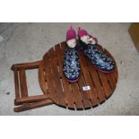 A pair of ladies size 6 ankle boots and a small wooden folding table.