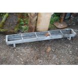 A galvanised feed trough, 5' long.