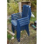 Four blue stacking chairs.