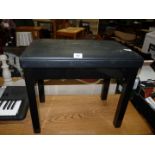 A black piano stool.