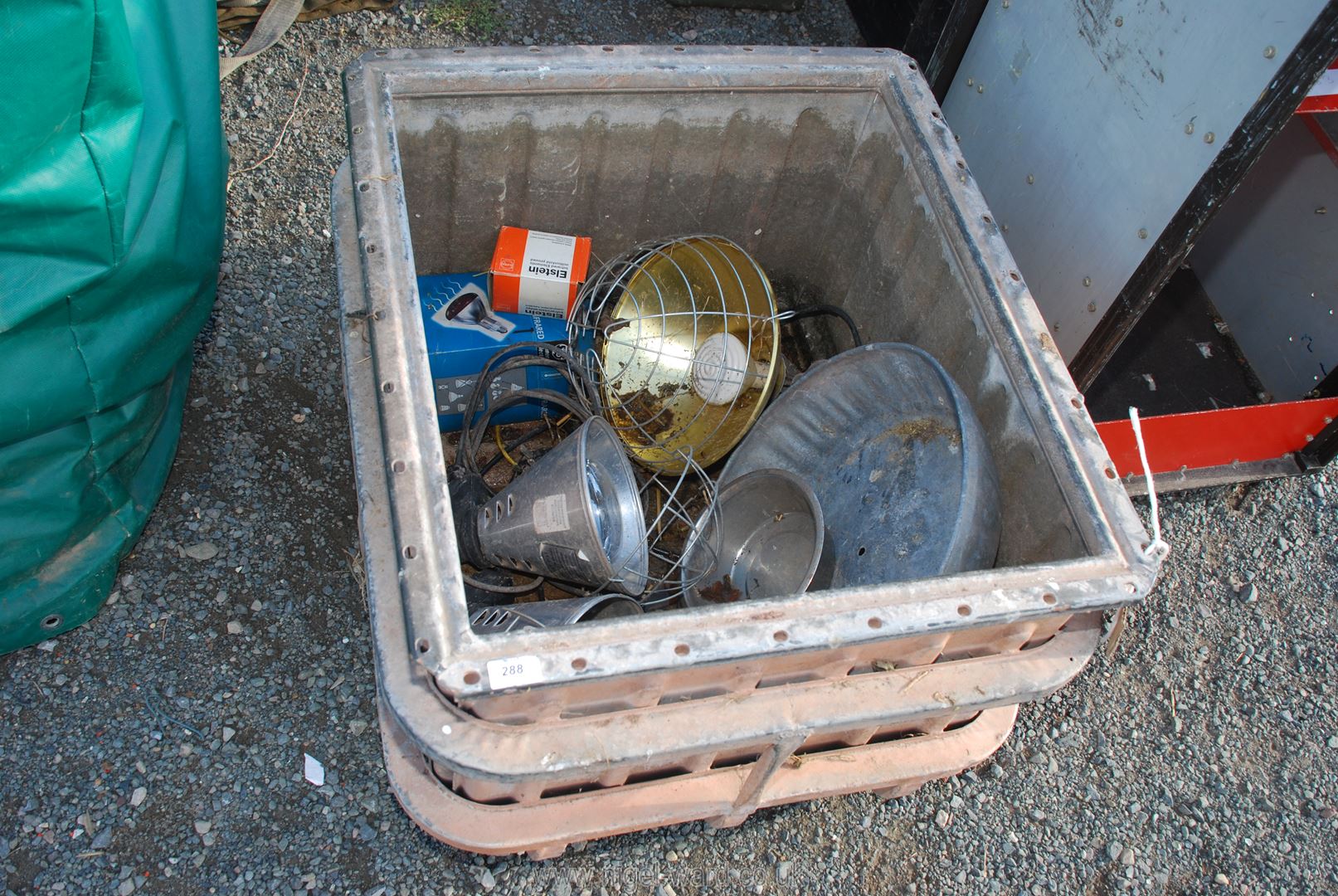 Infrared lamps in a galvanised container.