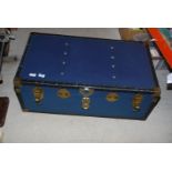 A blue travel trunk.