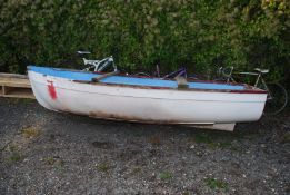 "Hit Mouse", a glass fibre boat/dinghy with three seats including the helmsman's at the stern,