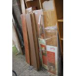 A quantity of assorted laminate flooring, different shades.