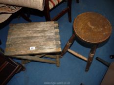 A slatted folding stool plus another stool.