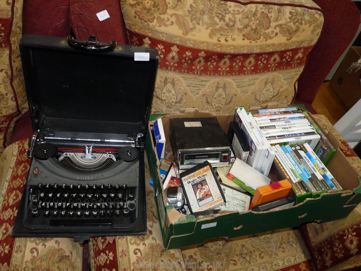 An 'Oliver' typewriter, plus a box of Nintendo Wii and Xbox games, etc.