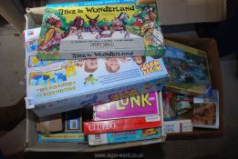 Two boxes of games and jigsaws.
