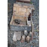 An old wooden candle box, 2 blow lamps, edging gloves, tilley lamps and 2 sets of Salter scales.