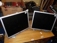 A pair of Dell monitor screens.