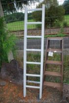 A painted wooden ladder.