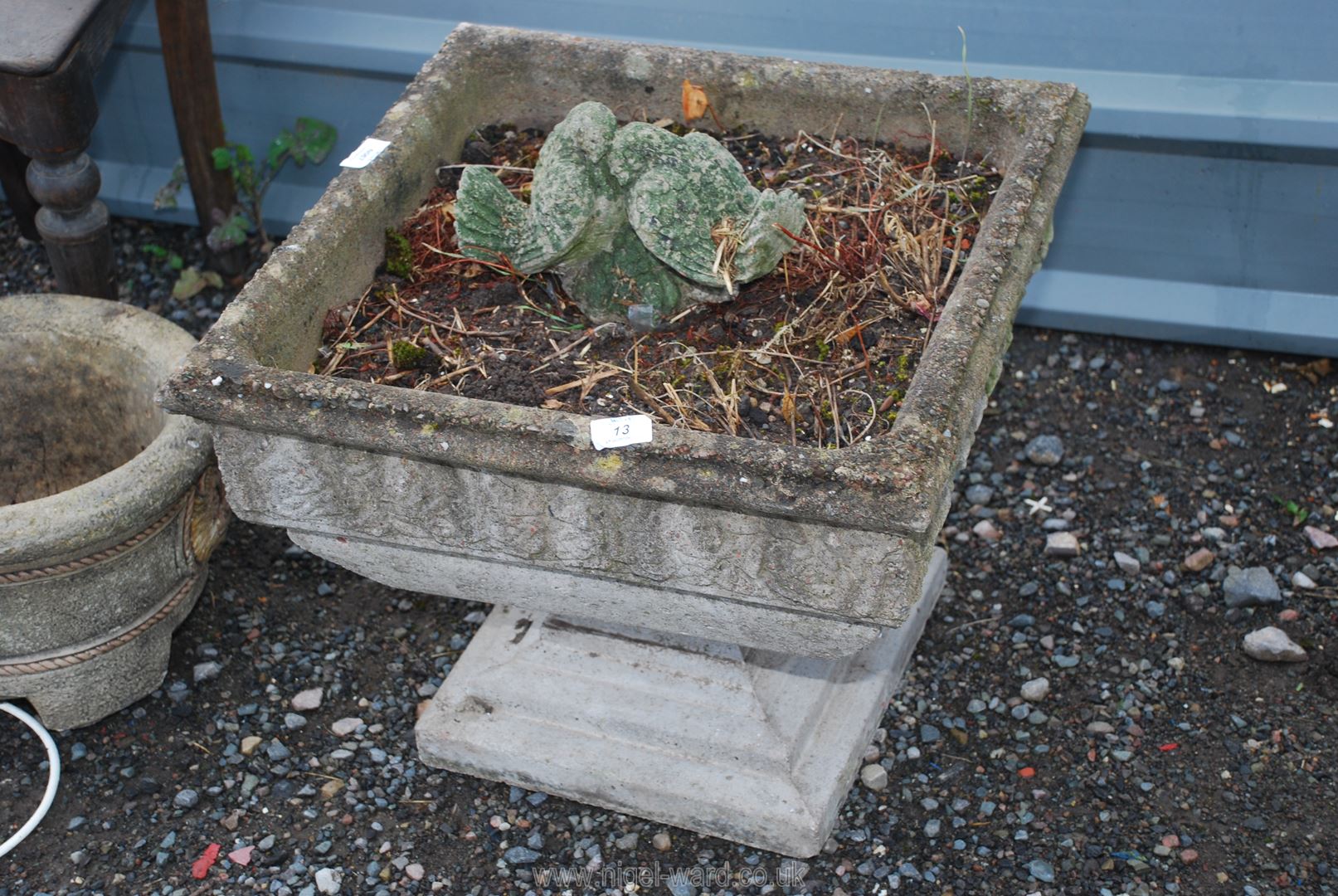 A square concrete planter, 19'' square and bird ornament.
