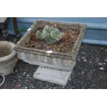 A square concrete planter, 19'' square and bird ornament.