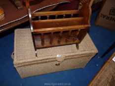 *A String Linen Basket and a dark wood Magazine Rack.