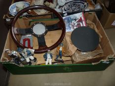 A box of miscellanea including steering wheel, cooker element, four figures, etc.