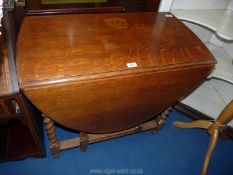 A dark wood drop leaf table.