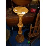 A light oak jardiniere stand, 38 1/2" tall.