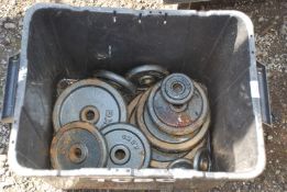 A box of cast iron weightlifting weights.