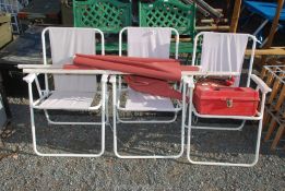 Three folding chairs, a plastic tool box, oil can and roller blinds.