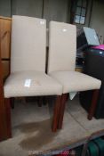 Two upholstered dining chairs.