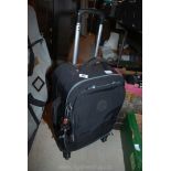 A black wheeled 'Kipling' travel bag with 2 handbags and purse, all in good condition.