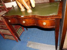 A writing desk with green leather top.
