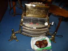 A brass and chrome electric fire with amber coloured coal effect.