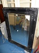 A large black framed bevelled Mirror, 45'' high x 33'' wide.