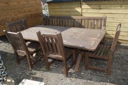 A large garden table with four chairs and a bench, 7' x 43" wide,