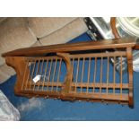 A pine wall mounted plate rack.
