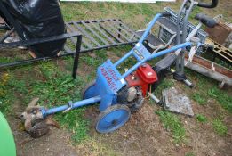 A 'Suffolk Gardenmaster' rotavator, in working order, with four stroke engine.