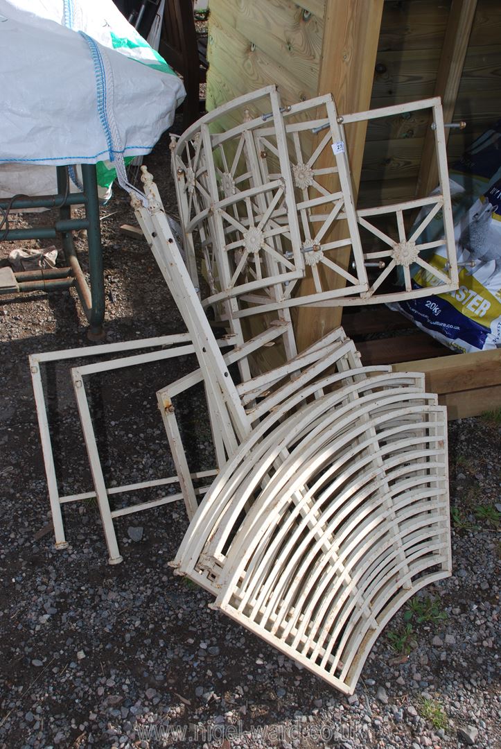 A metal wrap around tree bench.