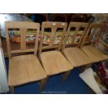 *Four rustic Oak kitchen chairs.