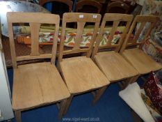 *Four rustic Oak kitchen chairs.